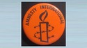 Amnesty International badges & postcards